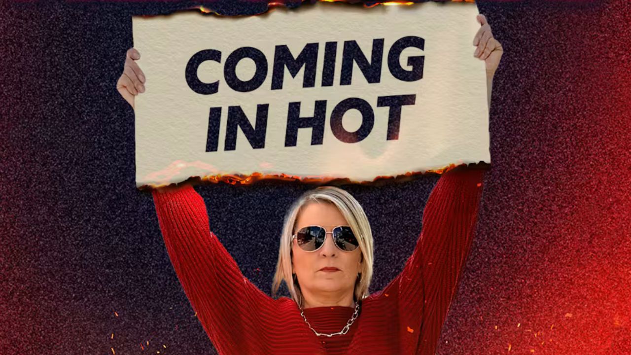a woman holding a sign overhead